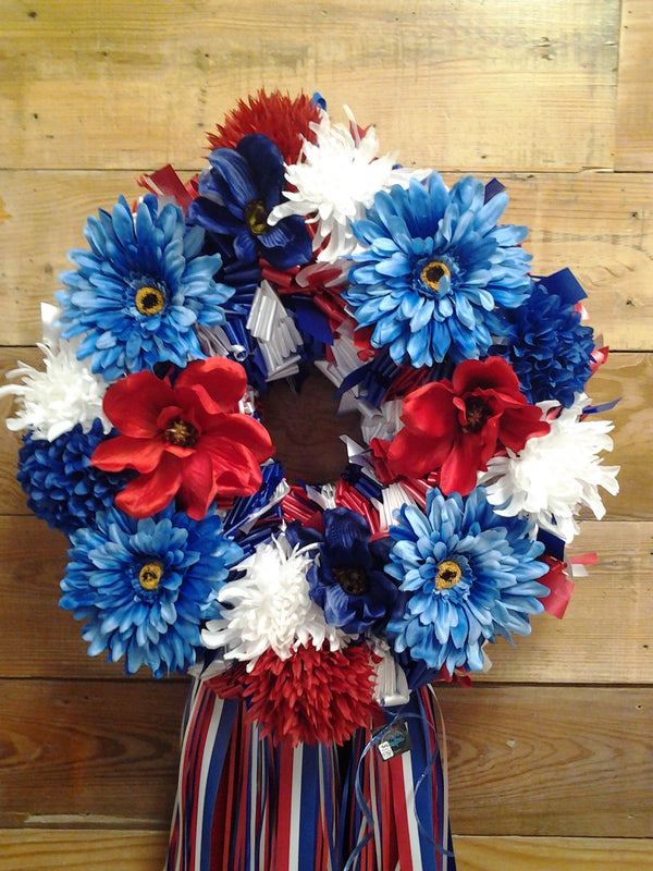 Red, White and Blue wreath with white Easel stand. Carnations, delphium and  white cushion poms with ribbons and stars. in Oxford, OH - OXFORD FLOWER  SHOP