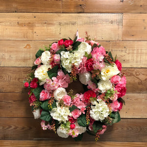 Fall in LOVE with this spectacular assortment of beautiful blooms!  Filled with a variety of silk cabbage roses, peonies, hydrangeas, cherry blossoms, assorted mini roses and faux eucalyptus, this wreath is a statement on its own. 